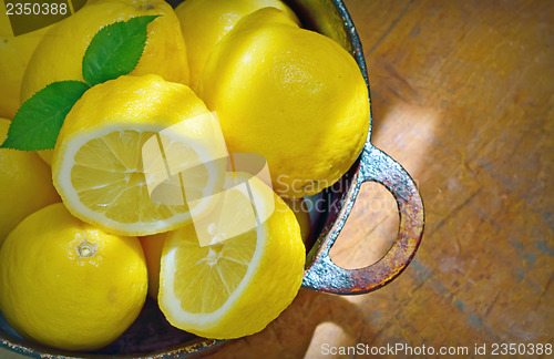 Image of fresh lemons on a wood table