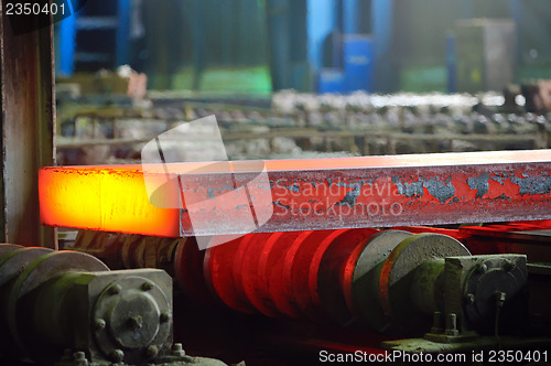 Image of hot steel on conveyor