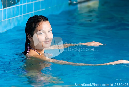 Image of Attractive girl in swimming pool