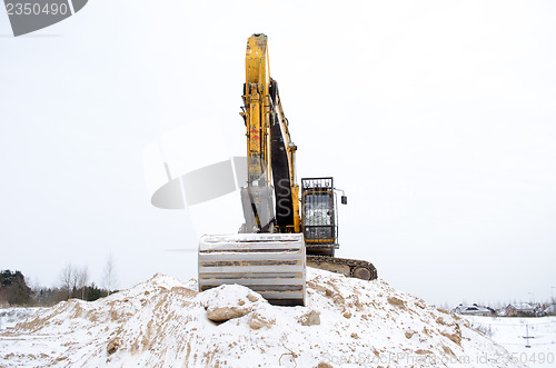 Image of excavator pile sand pit soil snow winter industry 