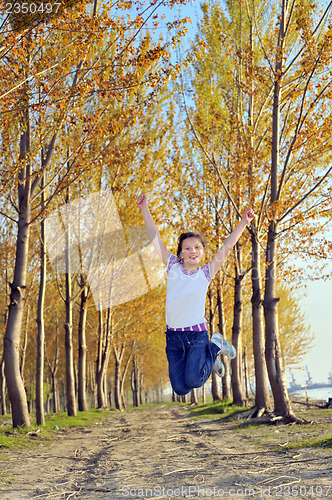 Image of Happy girl jumping 