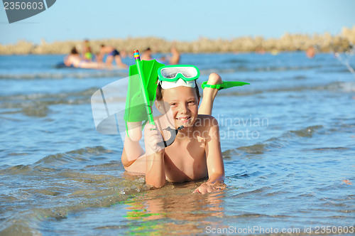 Image of boy in the sea on a beach