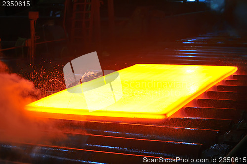 Image of hot steel on conveyor 