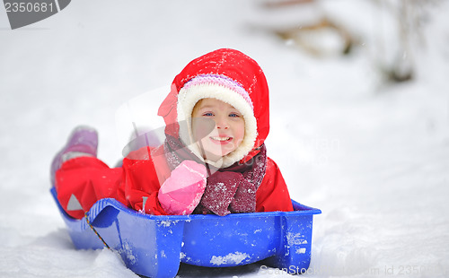 Image of Little girl on sleigh 