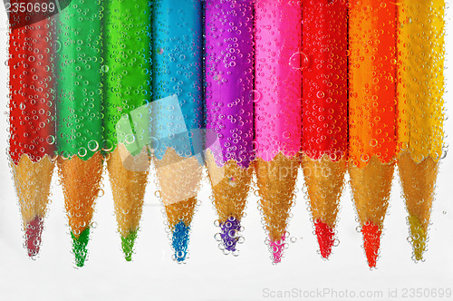 Image of colored pencils sunken in water