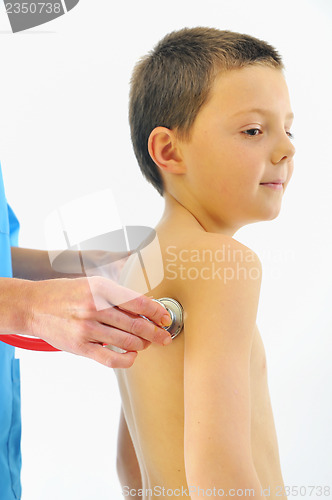 Image of boy having health check with stethoscope in hospital 