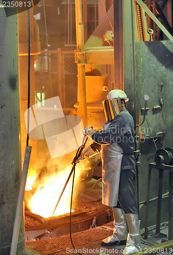 Image of worker with hot steel