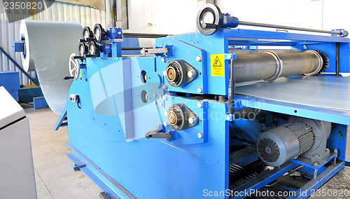 Image of machine for rolling steel sheet in warehouse 