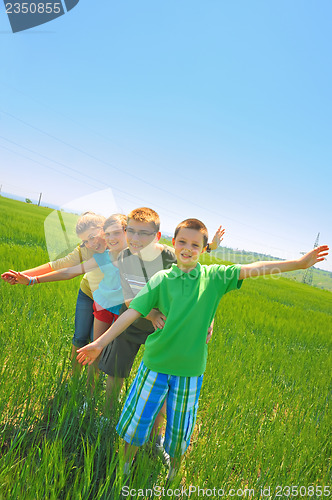 Image of kids play in wheat field