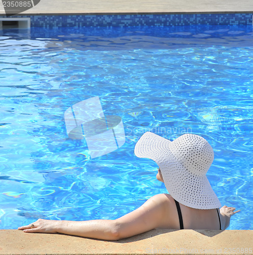 Image of Woman sitting in a swimming pool
