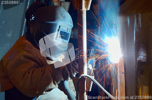 Image of a welder working at shipyard