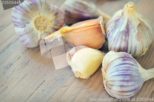 Image of Garlics on old wood
