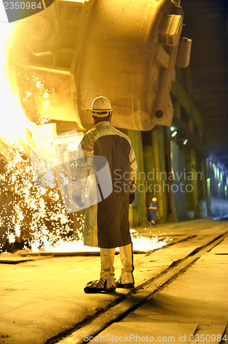 Image of steel worker in a factory