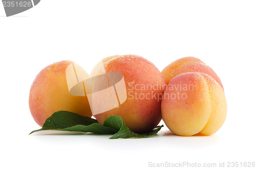 Image of Sweet peaches with leafs