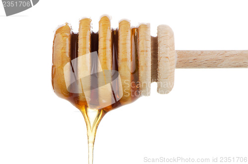 Image of Honey on wooden drizzler