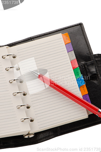 Image of Note book and pencil