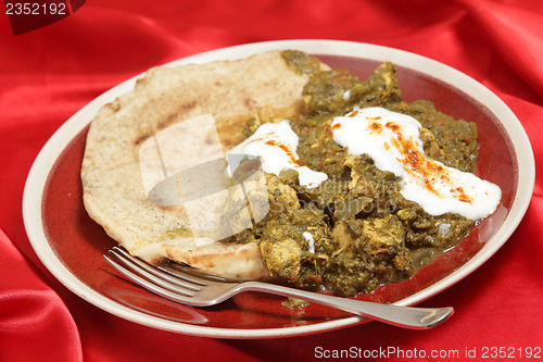 Image of Chicken saag with bread and yoghurt