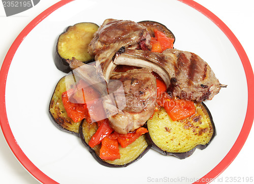 Image of Lamb chops on salsa high angle