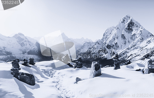 Image of Cho La pass and stone stacks at sunrise in Himalaya