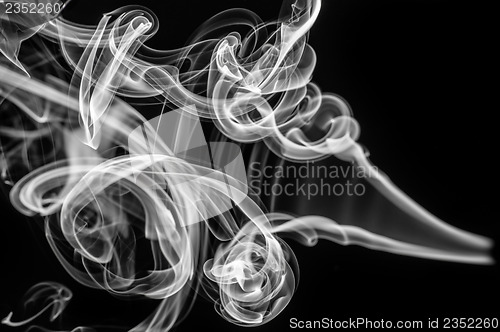 Image of Abstract pattern: white smoke swirls and curves 