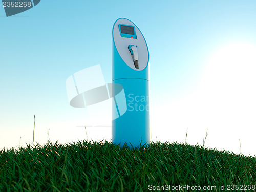Image of Charging station and green field at dawn