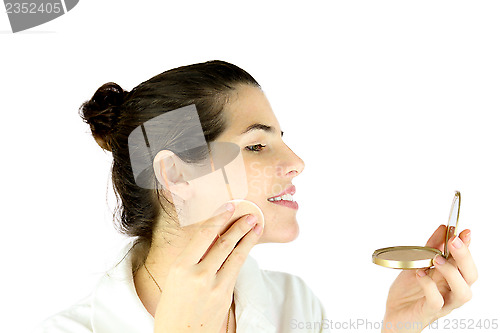 Image of Powdering her face