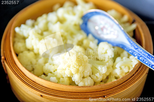 Image of chinese steam basket with cauliflower