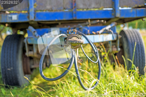 Image of old trailer hidden in the grass