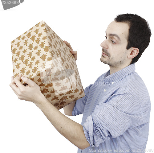 Image of Young man holding a present