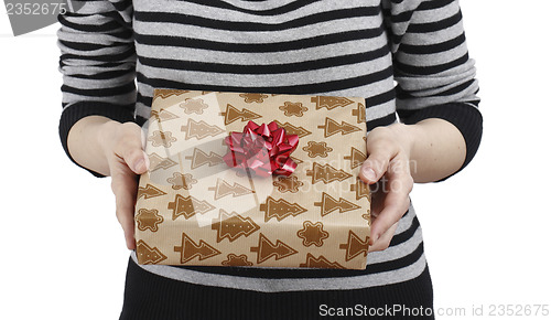 Image of Young woman holding a present