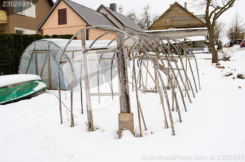 Image of greenhouse construction winter garden snow 