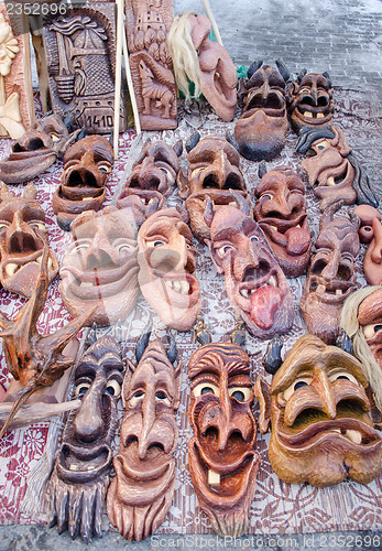 Image of wooden carved funny masks market fair rural crafts 