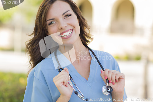 Image of Young Adult Woman Doctor or Nurse Portrait Outside