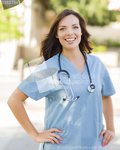 Image of Young Adult Woman Doctor or Nurse Portrait Outside