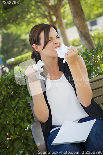 Image of Upset Young Woman with Pencil and Crumpled Paper in Hands