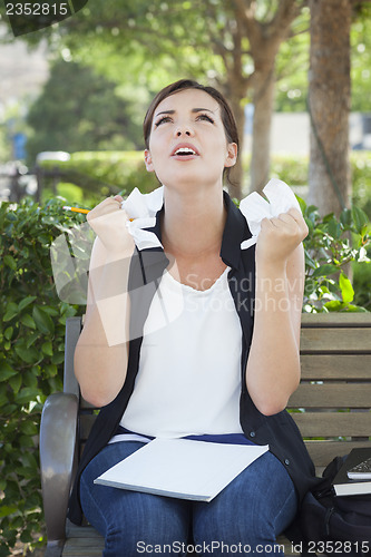 Image of Upset Young Woman with Pencil and Crumpled Paper in Hands