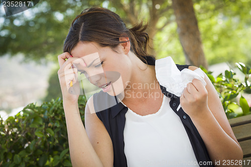 Image of Upset Young Woman with Pencil and Crumpled Paper in Hand