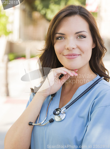 Image of Young Adult Woman Doctor or Nurse Portrait Outside