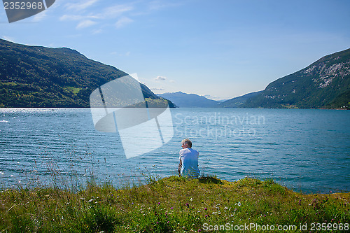 Image of Man watching the sea