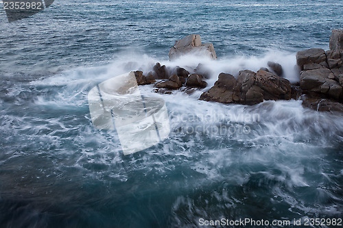 Image of rock and wave