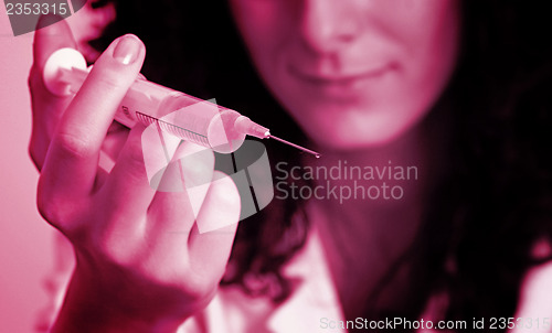 Image of Portrait of a young doctor with syringa.