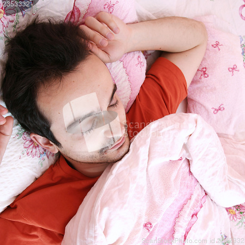 Image of Young man sleeping .