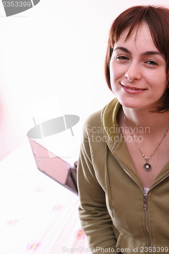 Image of Young woman in bed