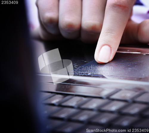 Image of Working at laptop .