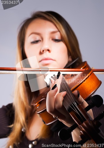 Image of Woman playing on violin