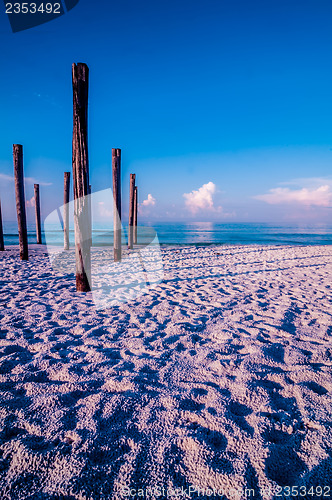 Image of old sea pier ruins on the beach