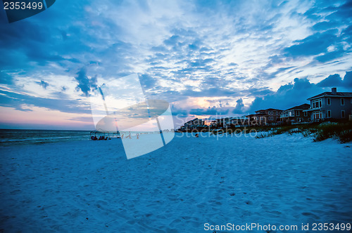 Image of sunset on florida beach with white sand and blue sky