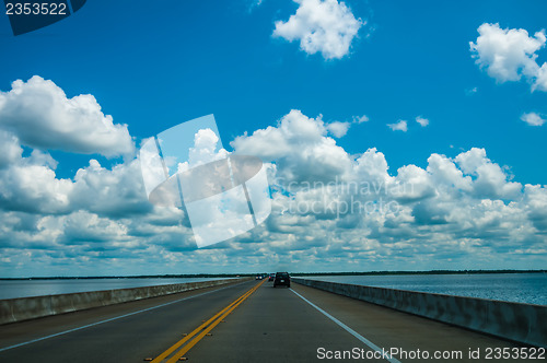 Image of driving on road with water on both sides