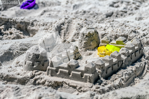 Image of sand castle structures built at seashore