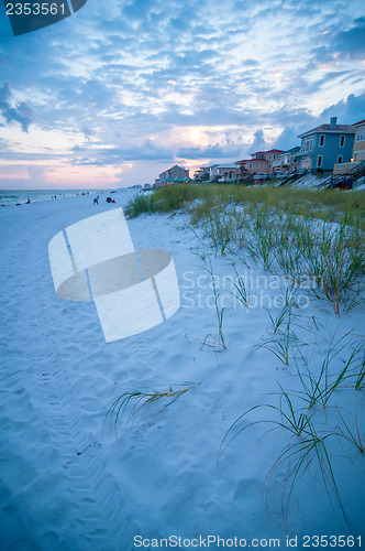 Image of sunset on florida beach with white sand and blue sky